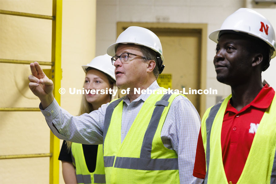 Bruce Dvorak, center, Professor of Civil and Environmental Engineering, discusses Lincoln’s Theresa Street Wastewater Treatment Plant northeast of Innovation Campus with Yves Cedric Tamwo Noubissi, right, senior in Mechanical Engineering, center and Sussan Moussavi, graduate student in Civil Engineering. September 23, 2022. Photo by Craig Chandler / University Communication.