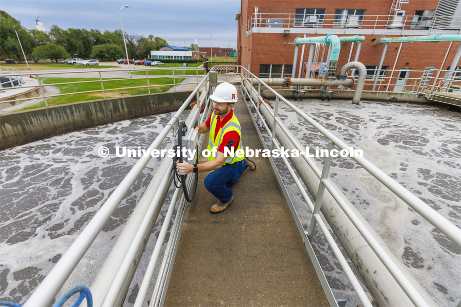Andrew Hansen, graduate student in Environmental Engineering, looks over a control box for a sedimentation tank. Bruce Dvorak, Professor of Civil and Environmental Engineering, works with students at Lincoln’s Wastewater Treatment Plant northeast of Innovation Campus. September 23, 2022. Photo by Craig Chandler / University Communication.