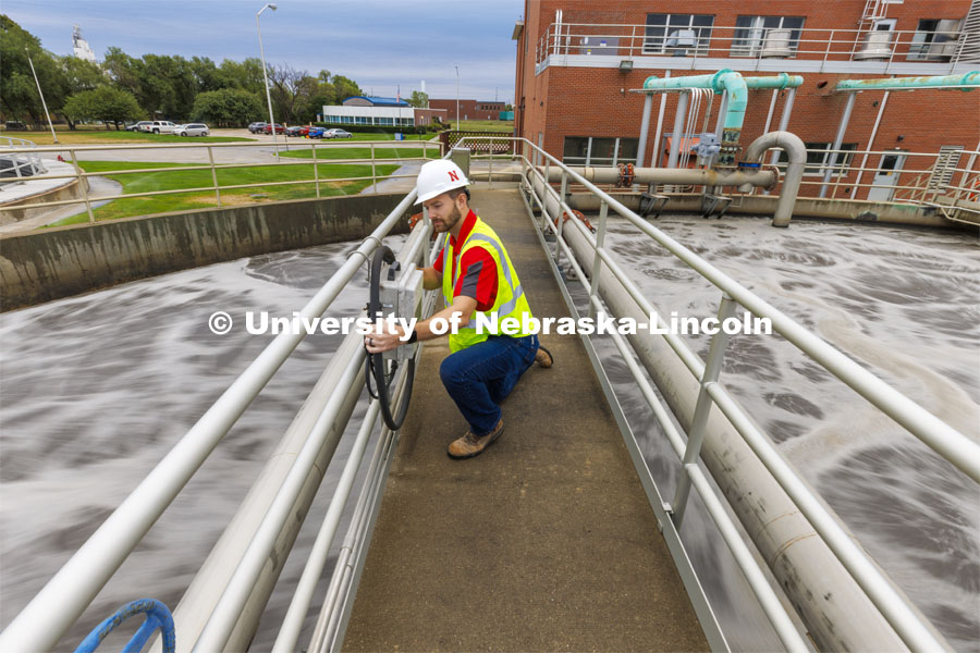 Andrew Hansen, graduate student in Environmental Engineering, looks over a control box for a sedimentation tank. Bruce Dvorak, Professor of Civil and Environmental Engineering, works with students at Lincoln’s Wastewater Treatment Plant northeast of Innovation Campus. September 23, 2022. Photo by Craig Chandler / University Communication.