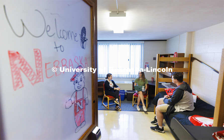 Students socializing in their dorm rooms. Housing Photo Shoot in Able Sandoz Residence Hall. September 27, 2022. Photo by Craig Chandler / University Communication.