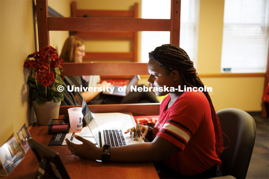 Students use their laptops to study in a University Suites Residence Hall room. Housing Photo Shoot in University Suites Residence Hall. September 27, 2022. Photo by Craig Chandler / University Communication.