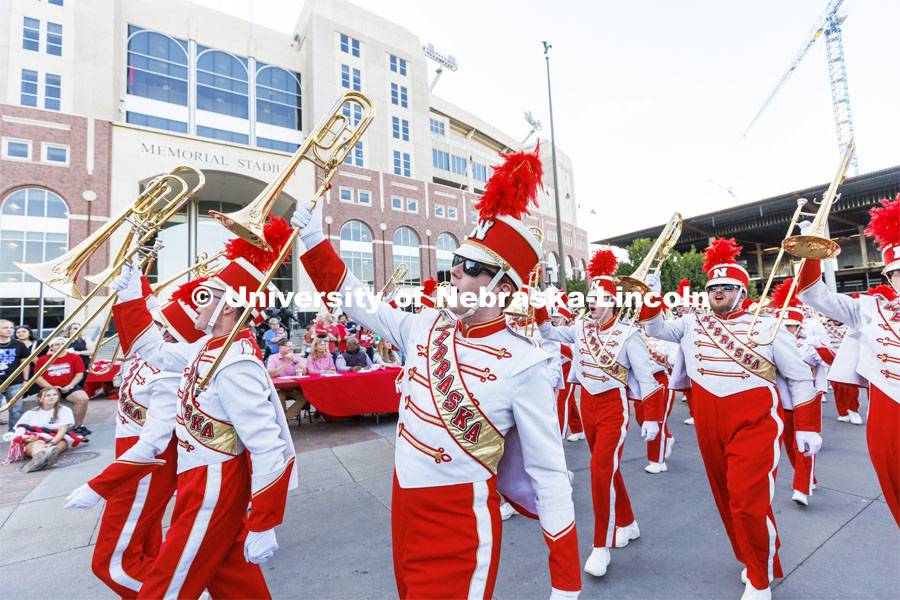 The Cornhusker Marching Band shows their spirit as they march past the judges table in front of Memorial Stadium. Homecoming Parade and Cornstalk. September 30, 2022. Photo by Craig Chandler / University Communication.