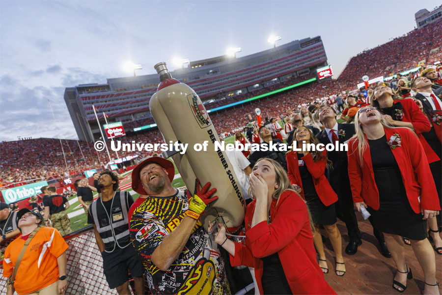 Members of the Homecoming Court get the chance to launch a hotdog with Der Viener Schlinger. Nebraska vs. Indiana football Homecoming game. October 1, 2022. Photo by Craig Chandler / University Communication.