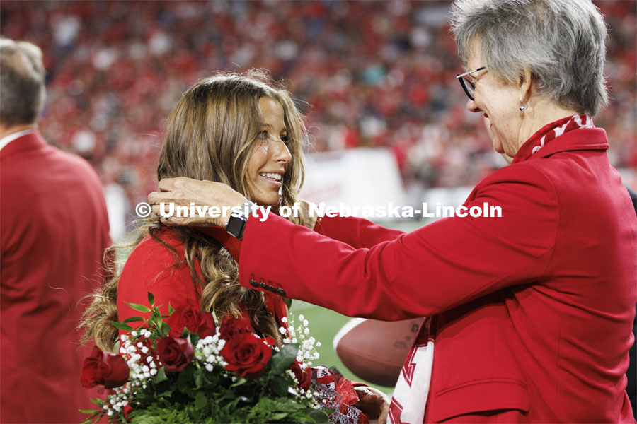 Newly crowned homecoming royalty Emily Hatterman has a medallion placed over her by Jane Green. Nebraska vs. Indiana football Homecoming game. October 1, 2022. Photo by Craig Chandler / University Communication.