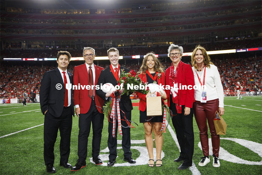 Newly crowned homecoming royalty Jacob Drake and Emily Hatterman are joined with (from left) 2021 royalty Bobby Martin, Chancellor Ronnie Green, Jane Green and Nebraska Alumni Executive Director Shelley Zaborowski. Nebraska vs. Indiana football Homecoming game. October 1, 2022. Photo by Craig Chandler / University Communication.
