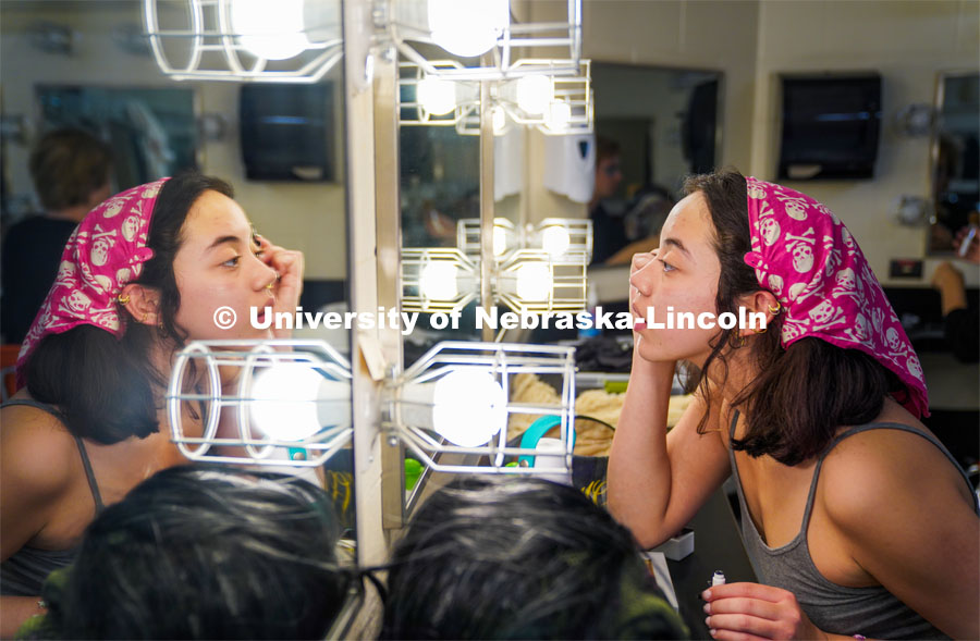 Aurora Villarreal applies stage makeup before the Shakesfear Haunted house on October 12. As a longtime horror fan and recent Shakespeare convert, senior theatre performance major Aurora Villarreal sees their opportunity to play Lady Macbeth in UNL Repertory Theatre’s ShakesFEAR production as a particularly exciting — and unique — acting experience. October 12, 2022. Photo by Dillon Galloway for University Communication.