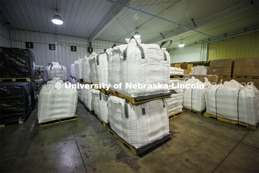 Each bag holds one ton of popcorn. The popcorn is stored at their facility before it is bagged and shipped around the world. Preferred Popcorn grows popcorn near Chapman, Nebraska and throughout the area. It is headed by Norm Krug. October 13, 2022. Photo by Craig Chandler / University Communication.