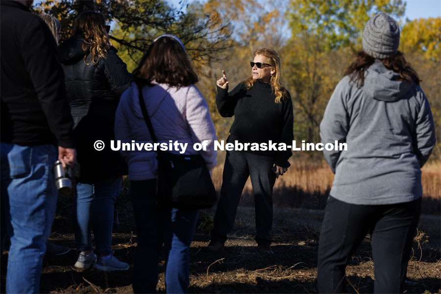 Sophia Perdikaris talks with academic counselors on a tour of Reller Prairie in southwest Lancaster County. October 17, 2022. Photo by Craig Chandler / University Communication.