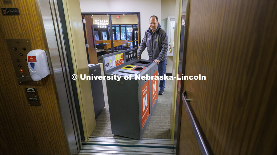 Chad Ebke, a senior material service worker with Facilities Management and Planning-Business Operations, moves a new recycling station onto the elevator in Gwendolyn A. Newkirk Human Sciences Building on East Campus for its new home on the upper floors of the building. October 18, 2022. Photo by Craig Chandler / University Communication.