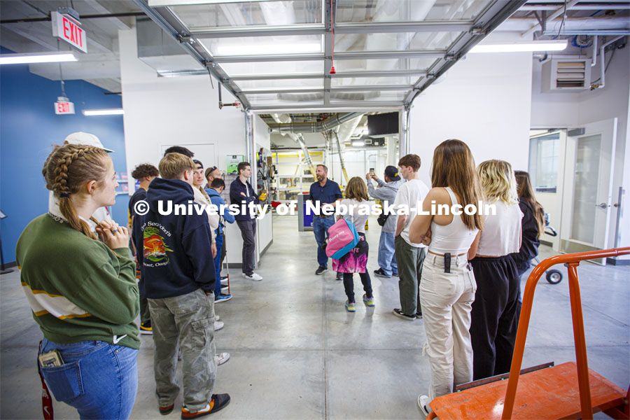 Jerry Reif (center) speaks with Bay High students outside the woodshop in Nebraska Innovation Studio. Bay Highschool students tour Innovation Studio. Bay High and NIC explore a future partnership together. October 20, 2022. Photo by Deann Gayman / University Communication.