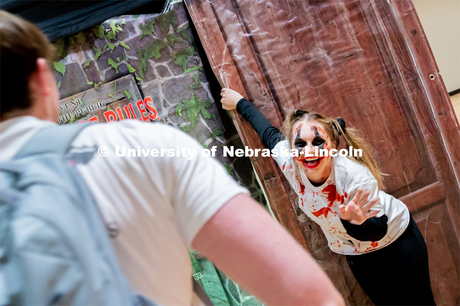 Student and performer, Madison Garrow, greets students as they enter the haunted house at the Husker Haunt in the Nebraska East Union. October 20, 2022. Photo by Jonah Tran / University Communication.