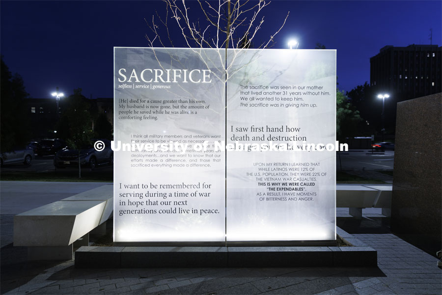 Veterans Tribute lit up at night outside the Military and Naval Science Building. October 21, 2022. Photo by Craig Chandler / University Communication.