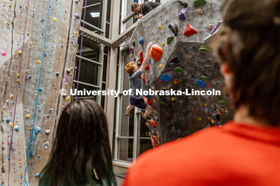 Kaleb McQuillan, first year master’s student, climbing a boulder route during the League of Extraordinary Boulderers. League of Extraordinary Boulderers scale the climbing wall at Campus Recreation’s Outdoor Adventure Center. November 3, 2022. Photo by Jonah Tran / University Communication.