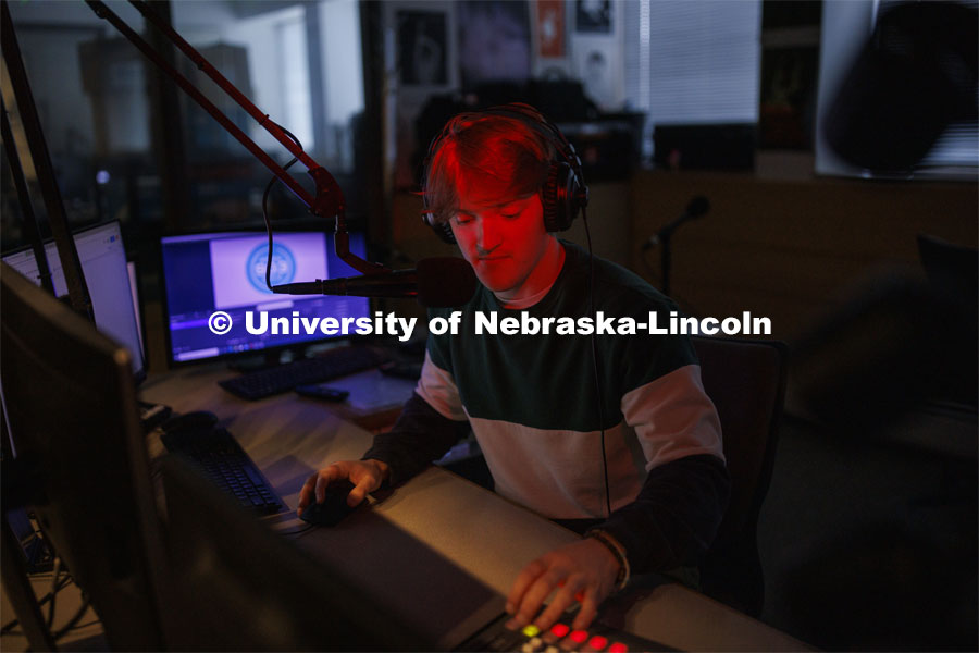 Ryan Luetkemeyer, a sophomore from St. Louis, does the afternoon broadcast from the booth at KRNU. November 9, 2022. Photo by Craig Chandler / University Communication.