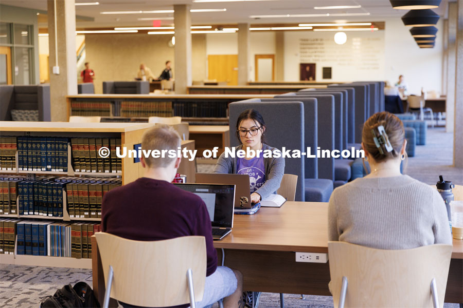 First year law student Paige Langley from Sydney, Nebraska, studies with friends in the renovated Schmid Law Library. November 10, 2022. Photo by Craig Chandler / University Communication.