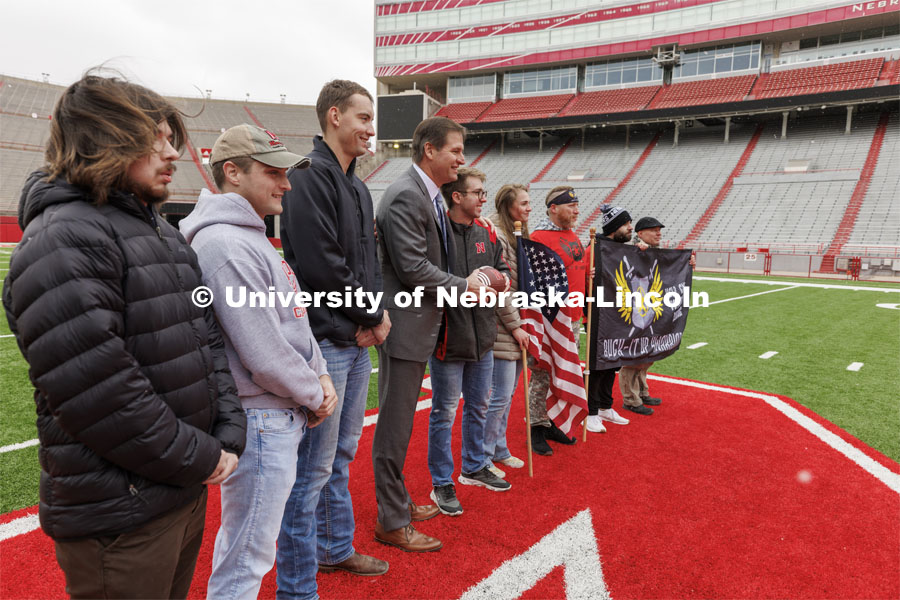 Nebraska Athletic Director Trev Alberts hands over the game ball that will be part of the Ruck March and walked to the Iowa game. November 15, 2022. Photo by Craig Chandler / University Communication.