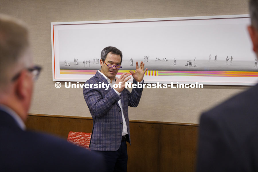 Francisco Souto (second from left) discusses "We Are Nebraska" with members of Chancellor Ronnie Green's executive leadership team. The artworks took 17 months to create and consists of graphite pencil drawings of students, professors and Chancellor Ronnie Green. November 21, 2022. Photo by Craig Chandler / University Communication.