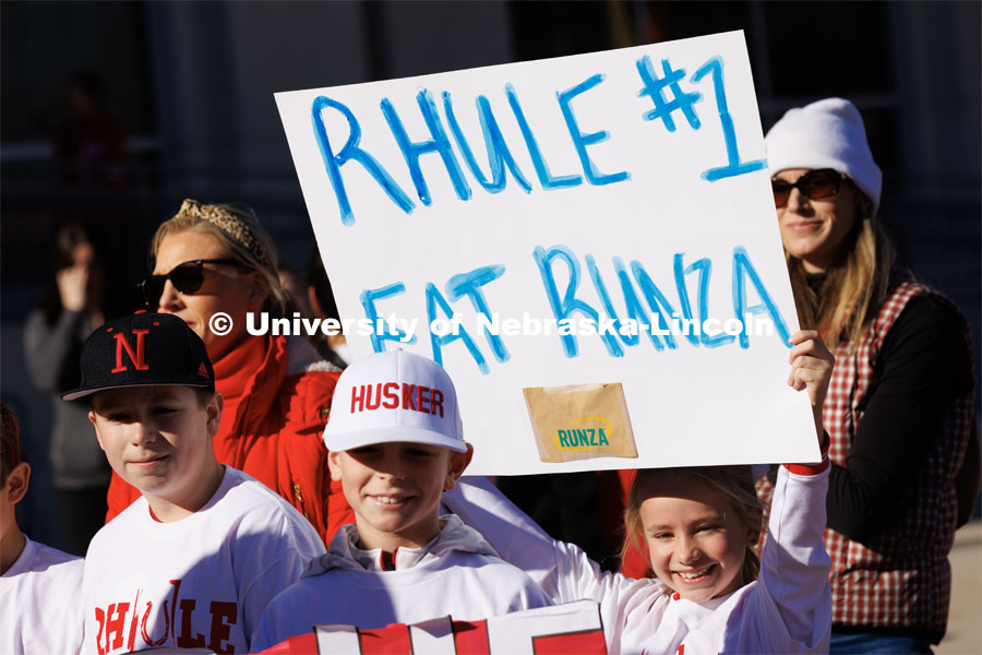 Second grader Elizabeth Owens holds up a sign to welcome Husker head football coach Matt Rhule. Rhule is introduced at a press conference in the Hawks Championship Center. November 28, 2022. Photo by Craig Chandler / University Communication.