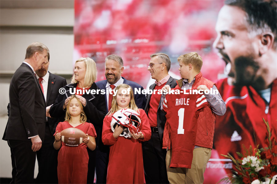 Husker head football coach Matt Rhule shares a laugh with Chancellor Ronnie Green as NU President Ted Carter talks with Rhule’s wife, Julie. In front of the group which includes NU athletic director Trev Alberts are Rhule’s children, Leona, Vivienne and Bryant, Rhule was introduced at a press conference in the Hawks Championship Center. November 28, 2022. Photo by Craig Chandler / University Communication.