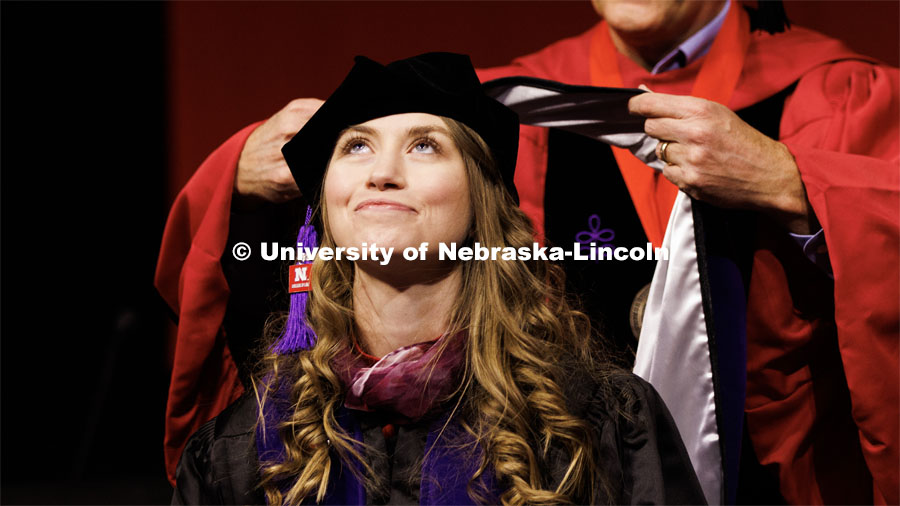 Shelby Riggs receives her Juris Doctor hood. Graduate Commencement in Pinnacle Bank Arena. December 16, 2022. Photo by Craig Chandler / University Communication.