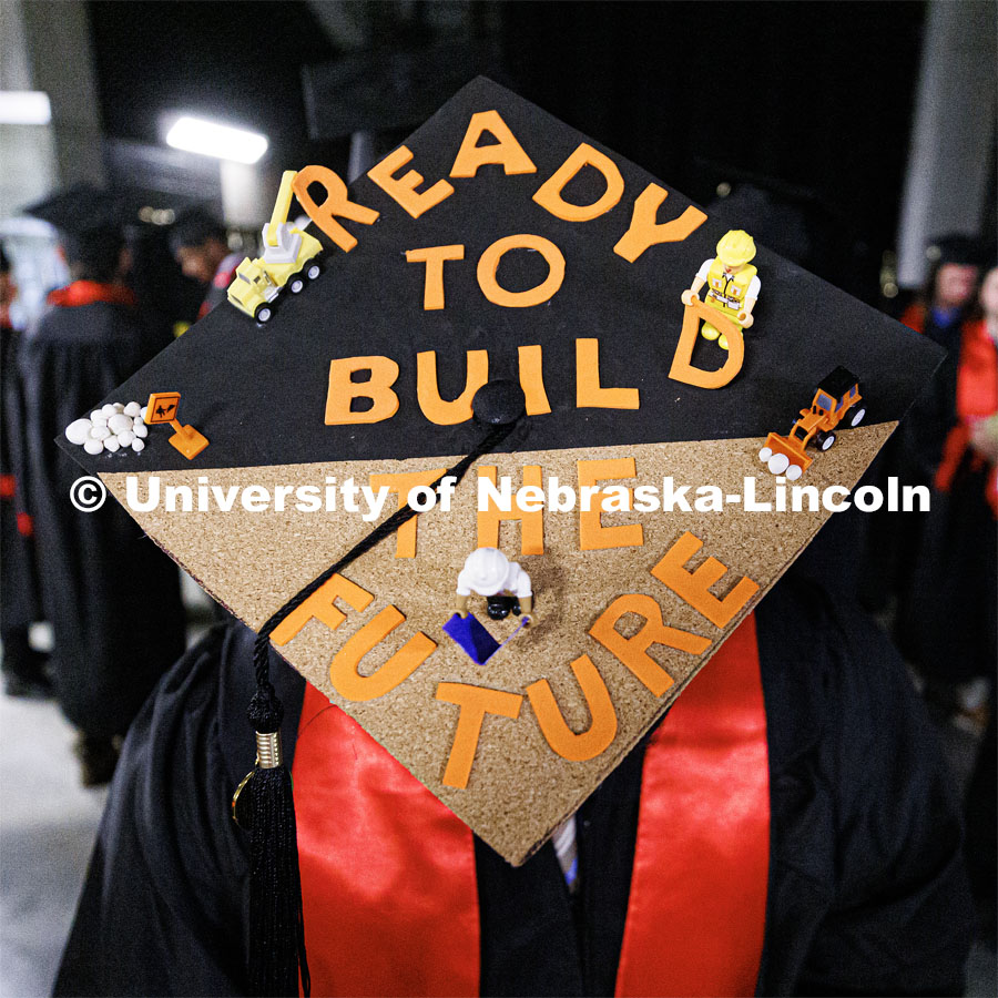 Construction Management graduate Mario Esquivel and his decorated mortar board. Winter Undergraduate Commencement in Pinnacle Bank Arena. December 17, 2022. Photo by Craig Chandler / University Communication.