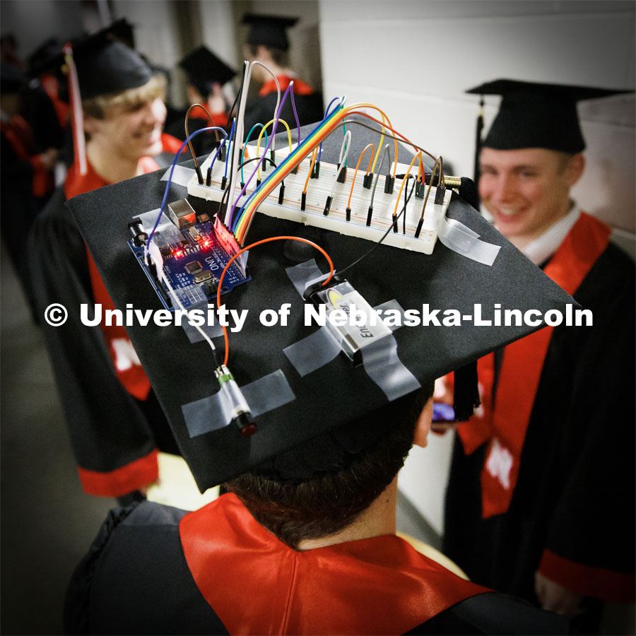 Electrical Engineering and Robotics graduate Daniel Webb and his decorated mortar board. Winter Undergraduate Commencement in Pinnacle Bank Arena. December 17, 2022. Photo by Craig Chandler / University Communication.