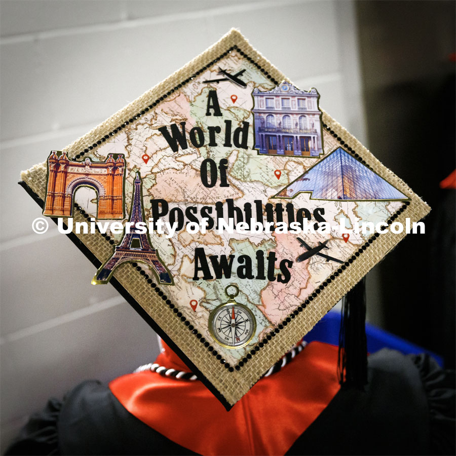 Finance graduate Christian Simmons and his decorated mortar board. Winter Undergraduate Commencement in Pinnacle Bank Arena. December 17, 2022. Photo by Craig Chandler / University Communication.