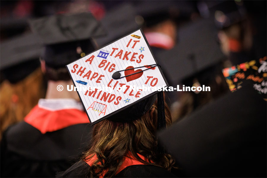 Callie Schleiger, a graduate in Child, Youth and Family Studies, wears her heart on her decorated mortar board. Winter Undergraduate Commencement in Pinnacle Bank Arena. December 17, 2022. Photo by Craig Chandler / University Communication.