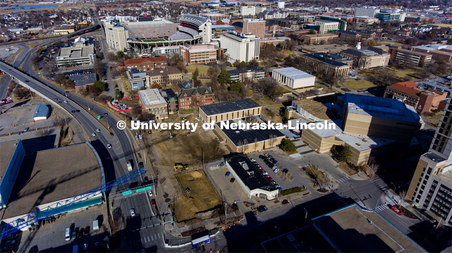 The former parking lots at 10th and Q are being excavated as the new Fine and Performing Arts building is being built. January 10, 2023. Photo by Craig Chandler / University Communication.
