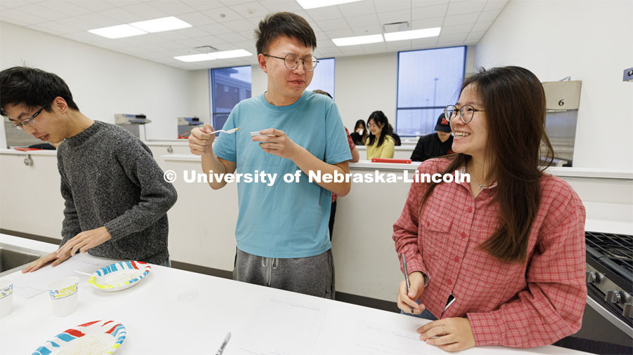 Nanqing Bian reacts to the taste of a soy sauce as he and teammates Zhengchun Han, left, and Yan Sun. Heather Hallen-Adams teaches FDST 492 - Special Topics in Food Science and Technology topic Moldy Meals: Koji and More. January 10, 2023. Photo by Craig Chandler / University Communication.