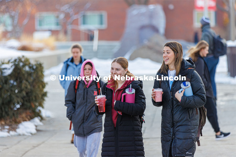 Kelli Kaufman from Geneva, Illinois, and Avery Knoll from West Bend, Wisconsin, head for class on the first day of spring semester. January 23, 2023. Photo by Craig Chandler / University Communication.