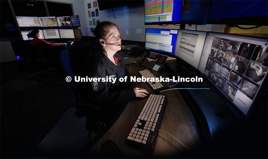 UNLPD Dispatcher Ella England watches a screen as she and fellow dispatcher Desiree Allum, left, work in the new space. UNL Police Department has redone their dispatch center. January 24, 2023. Photo by Craig Chandler / University Communication.