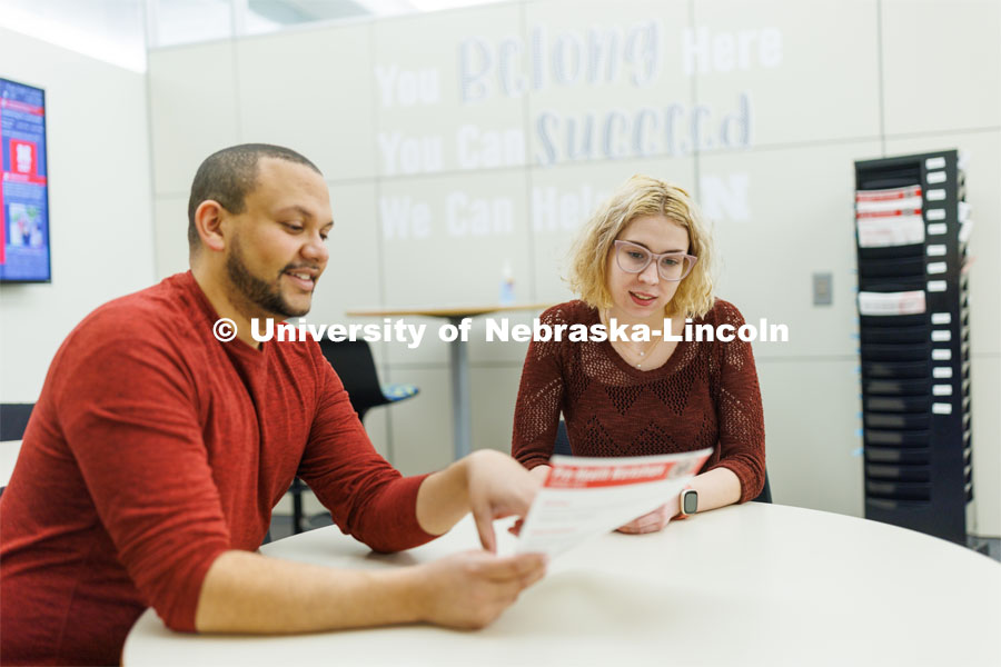 Clearthur Mangram, Director of the Explore Center helps a student. February 7, 2023. Photo by Craig Chandler / University Communication.