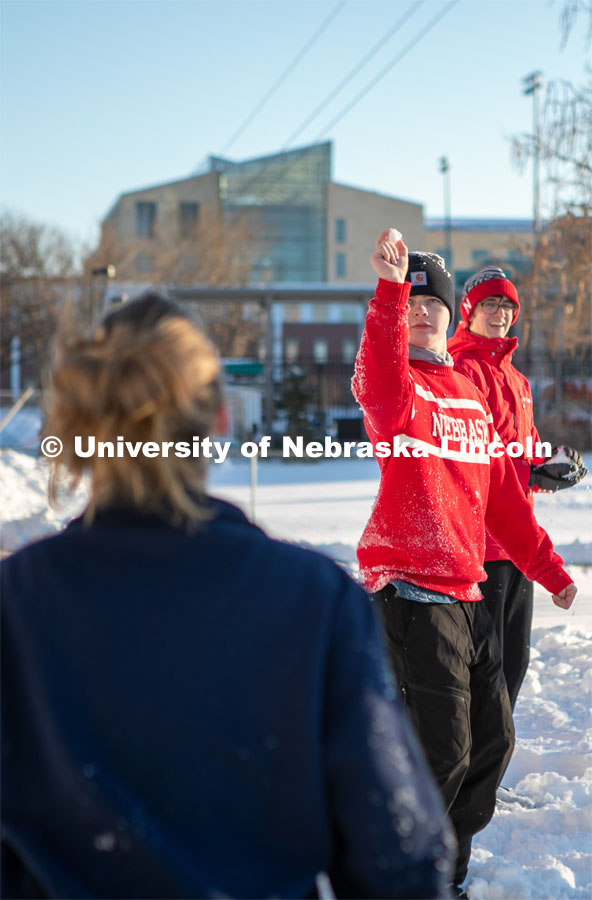 UNL students plays volleyball with friends on Thursday outside the Harper Schramm Smith residence halls.  Feb. 16, 2023. Photo by Sammy Smith for University Communication