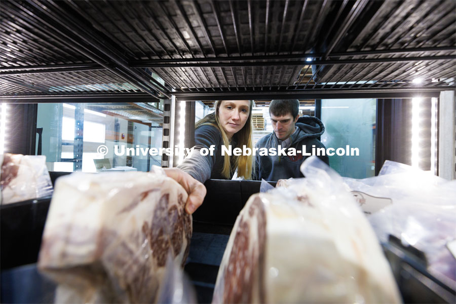 Hannah and Eric Klitz restock the freezer section at the Oak Barn Beef store in West Point, Nebraska. Oak Barn Beef was Hannah’s Engler project which combines Engler entrepreneurship and her beef genetics education at UNL. February 21, 2023. Photo by Craig Chandler / University Communication.