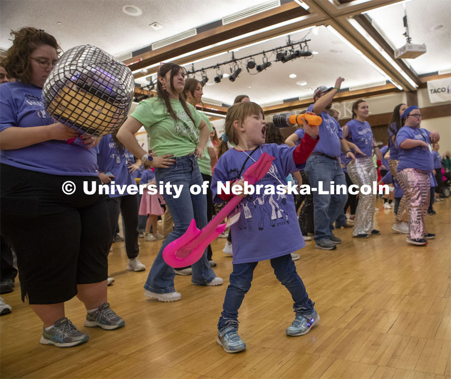 Marlys Williamson sings while the crowd learn the morale dance at Huskerthon 2023. University of Nebraska–Lincoln students raised $118,208 during the annual HuskerThon on Feb. 25. Also known as Dance Marathon, the event is part of a nationwide fundraiser supporting Children’s Miracle Network Hospitals. The annual event, which launched in 2006, is the largest student philanthropic event on campus. The mission of the event encourages participants to, “dance for those who can’t.” All funds collected by the Huskers benefit the Children’s Hospital and Medical Center in Omaha. February 25, 2023. Photo by Blaney Dreifurst for University Communication.