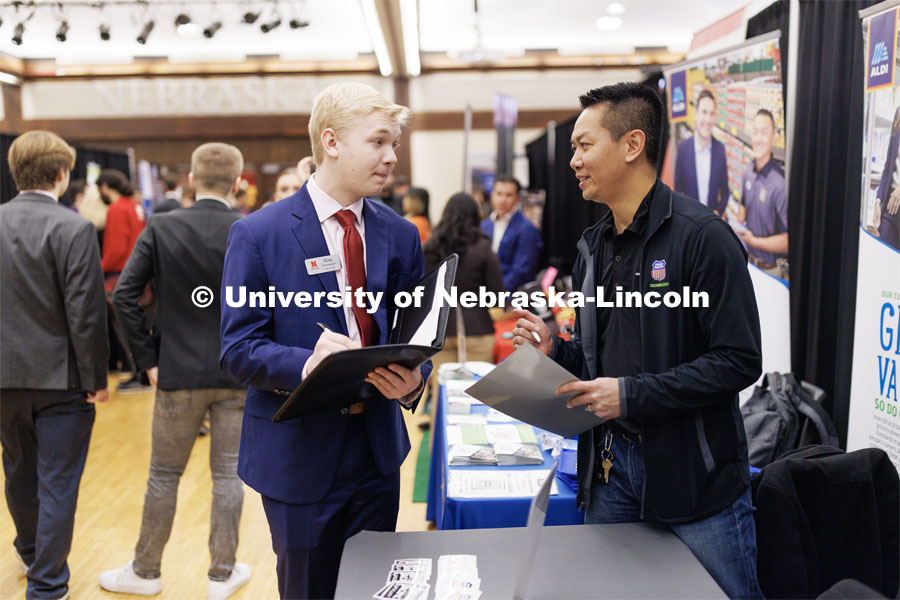 Max Sievenpiper talks with a recruiter from Union Pacific Railroad at the Career and Internship Fair in the Nebraska Union. February 28, 2023. Photo by Craig Chandler / University Communication.