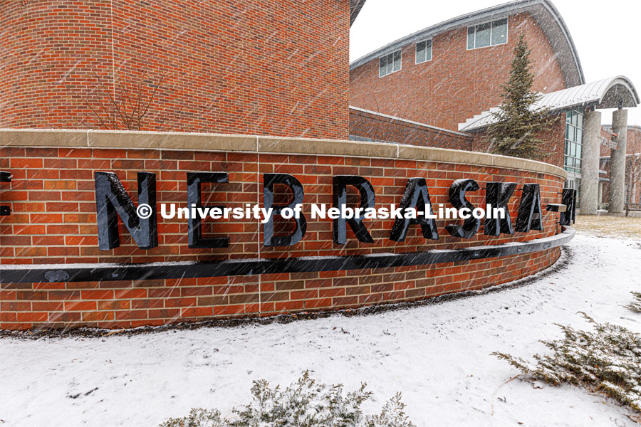 The Nebraska sign in front of the Van Brundt Visitor's Center is surrounded by snow. Spring Break snowstorm, City Campus. March 16, 2023. Photo by Craig Chandler / University Communication.