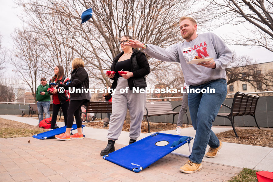 Out-of-state students enjoy playing outdoor games including corn hole during student admission’s National Tailgate at the Wick Alumni Center on Friday, March 24, 2023. during student admission’s National Tailgate at the Wick Alumni Center on Friday, March 24, 2023. 
 Photo by Jordan Opp for University Communication.