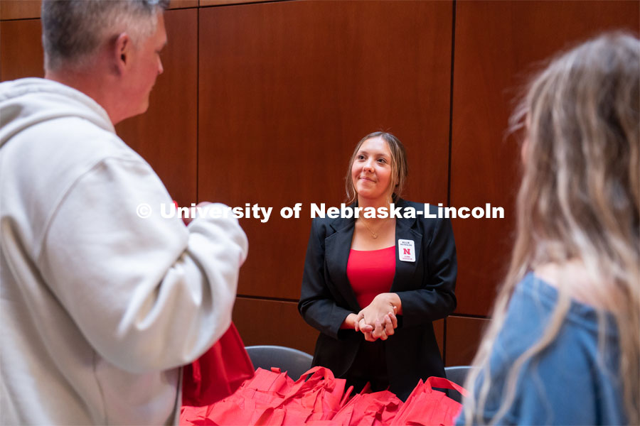 Allie Reynolds, center, greets incoming out-of-state students and family members during student admission’s National Tailgate at the Wick Alumni Center. Admitted Student Day is UNL’s in-person, on-campus event for all admitted students. March 24, 2023. Photo by Jordan Opp for University Communication.