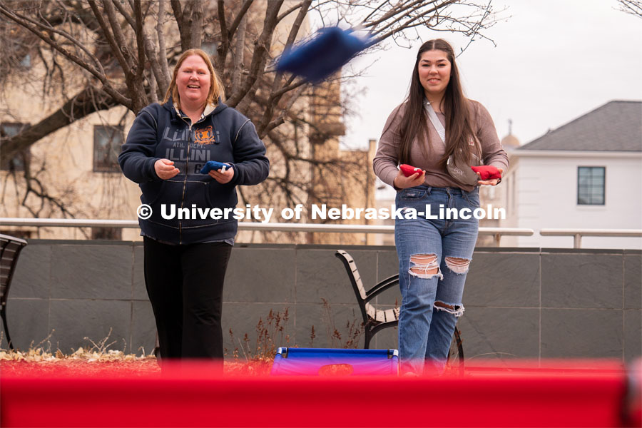 Out-of-state students enjoy playing outdoor games including corn hole during student admission’s National Tailgate at the Wick Alumni Center. Admitted Student Day is UNL’s in-person, on-campus event for all admitted students. March 24, 2023. Photo by Jordan Opp for University Communication.