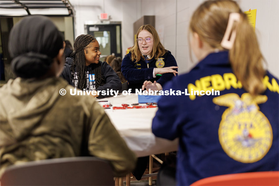 Breelyn Willmott of Blair, right, share a story with Geniah Story of Lincoln Northeast. FFA pen pals from urban and rural schools meet face-to-face during the FFA state convention. March 29, 2023. Photo by Craig Chandler / University Communication.