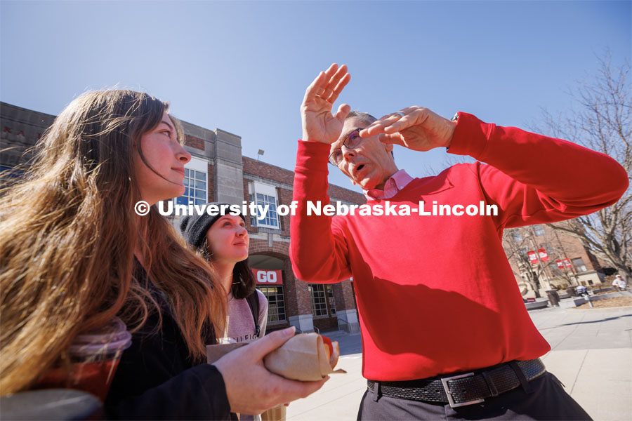 Freshman architecture students Cheyenne Storms, left, and Hannah Miller listen as Chancellor Ronnie Green describes the part of Architecture Hall recently torn down. I love UNL cookout sponsored by ASUN. April 4, 2023. Photo by Craig Chandler / University Communication.