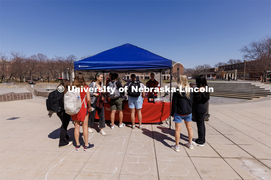 Students stand in line for a hotdog at the I love UNL cookout sponsored by ASUN. April 4, 2023. Photo by Craig Chandler / University Communication.
