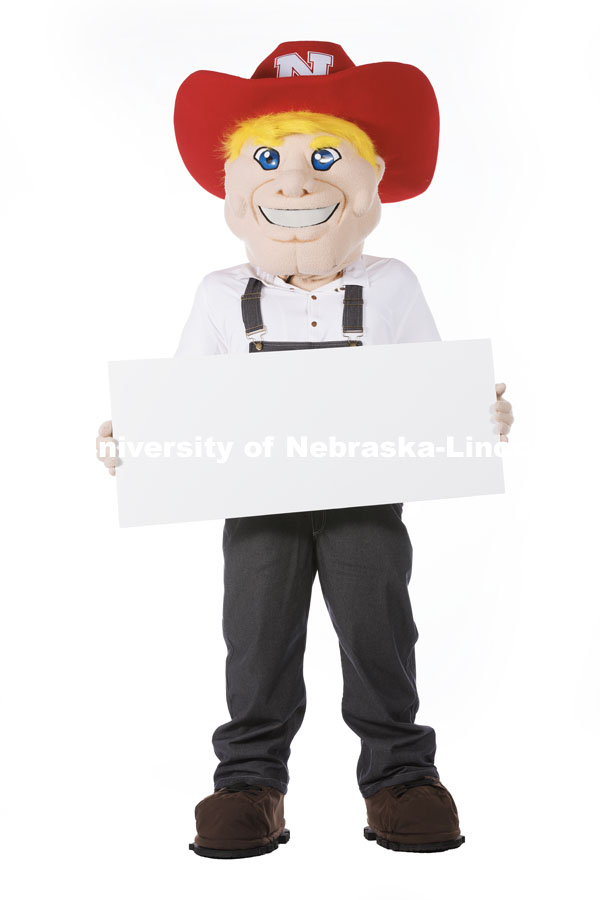 Studio portrait of Herbie holding a white card. New Herbie photoshoot. April 7, 2023. Photo by Craig Chandler / University Communication.