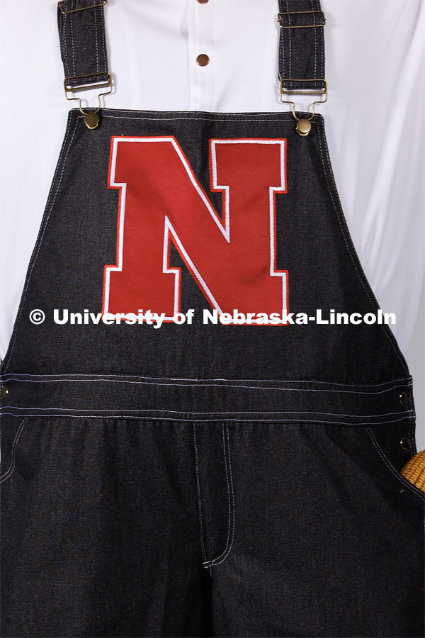 Closeup of Herbie's overalls with the big red N for Nebraska. New Herbie photoshoot. April 7, 2023. Photo by Craig Chandler / University Communication.