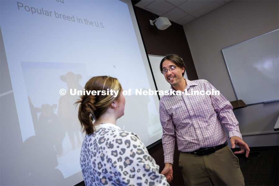 Nathan Conner, associate professor in agricultural leadership, education and communication, talks with Aurora Urwiler, a senior from Laurel, Nebraska, before her class presentation. He will soon embark on a Fulbright Fellowship to Jamaica. April 18, 2023. Photo by Craig Chandler / University Communication.