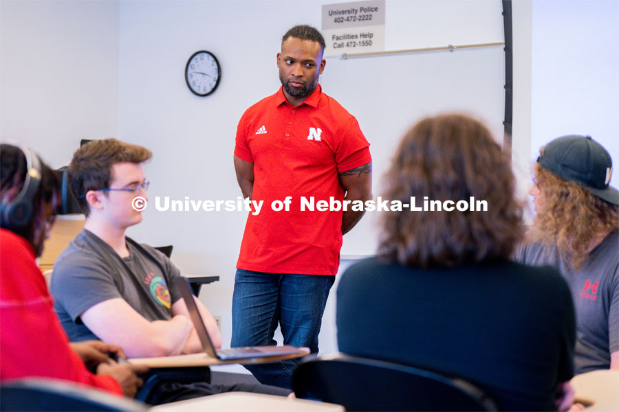 Ahman Green listens as students plan an esports event during his Intro to Esports class in Andersen Hall. April 19, 2023. Photo by Jordan Opp for University Communication.