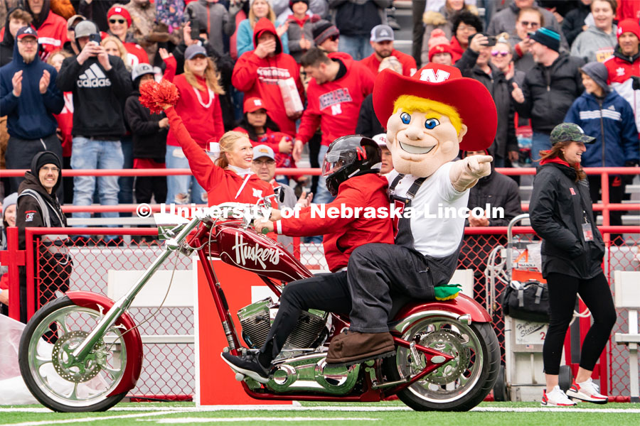 The new iteration of Herbie Husker rides onto the field inside Memorial Stadium before the Husker football spring game. April 22, 2023. Photo by Jordan Opp for University Communication.