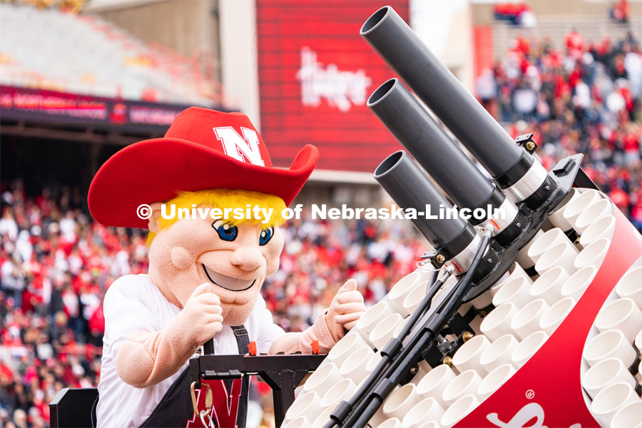 The new iteration of Herbie Husker operates a t-shirt canon the Husker football spring game. April 22, 2023. Photo by Jordan Opp for University Communication.